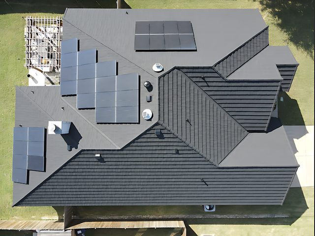 Burleson, TX — Stone coated Steel roofing system with bracket system for solar panels.