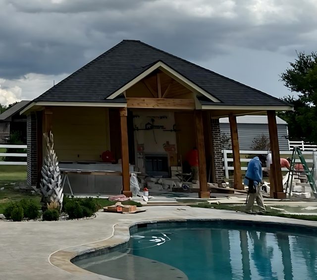 Burleson, TX — Pool house built with half bath, fireplace, outdoor kitchen and electrical. Designed to match main house.